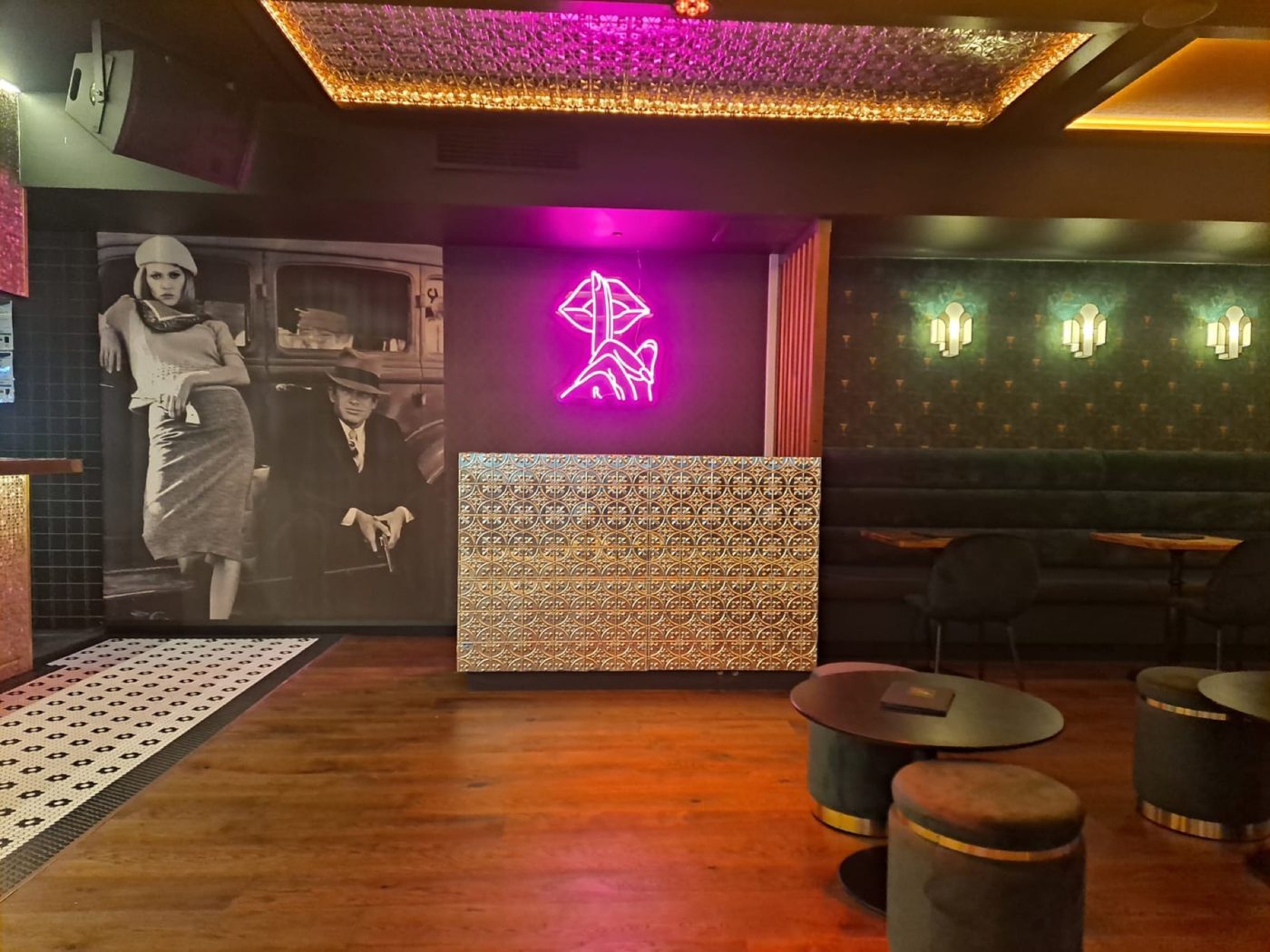 Bonnie & Clyde mural and neon in Follies