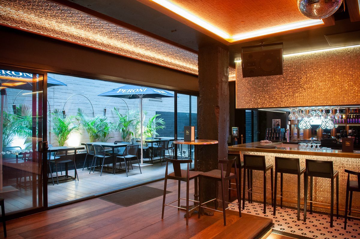 Follies bar opening onto the courtyard beer garden