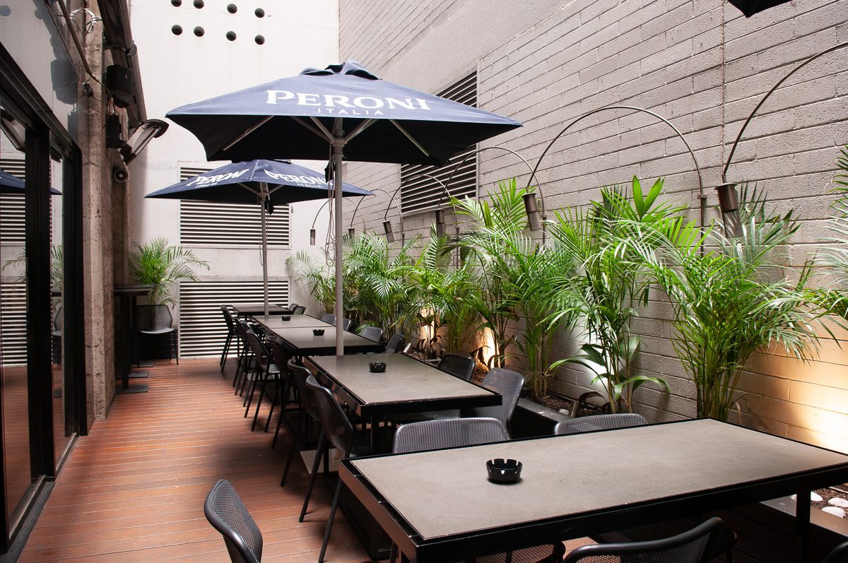 Follies courtyard beer garden under the Peroni umbrellas